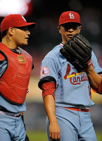 Reds play in sleeveless throwback uniforms against St. Louis Cardinals