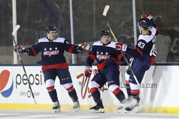 Capitals players celebrate a goal wearing 2018 Stadium Series uniform (Photo © Geoff Burke-USA TODAY Sport)