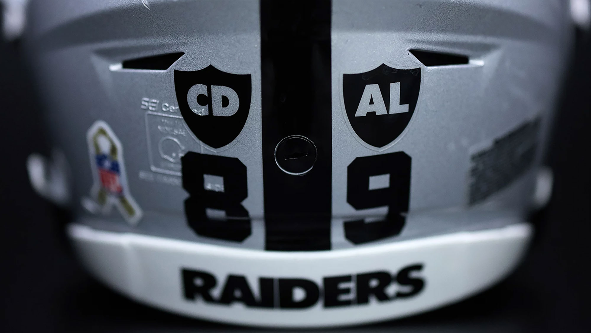 What Are The "CD," "AL" Decals On The Las Vegas Raiders' Helmets?